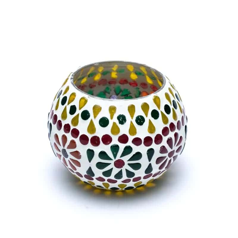 A white bowl with Мозаечен стъклен свещник Цвете designs resembling flowers.