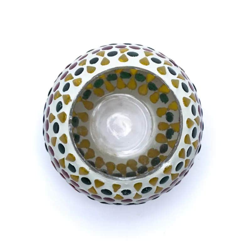 A small bowl with a colorful Мозаечен стъклен свещник Цвете pattern on it.