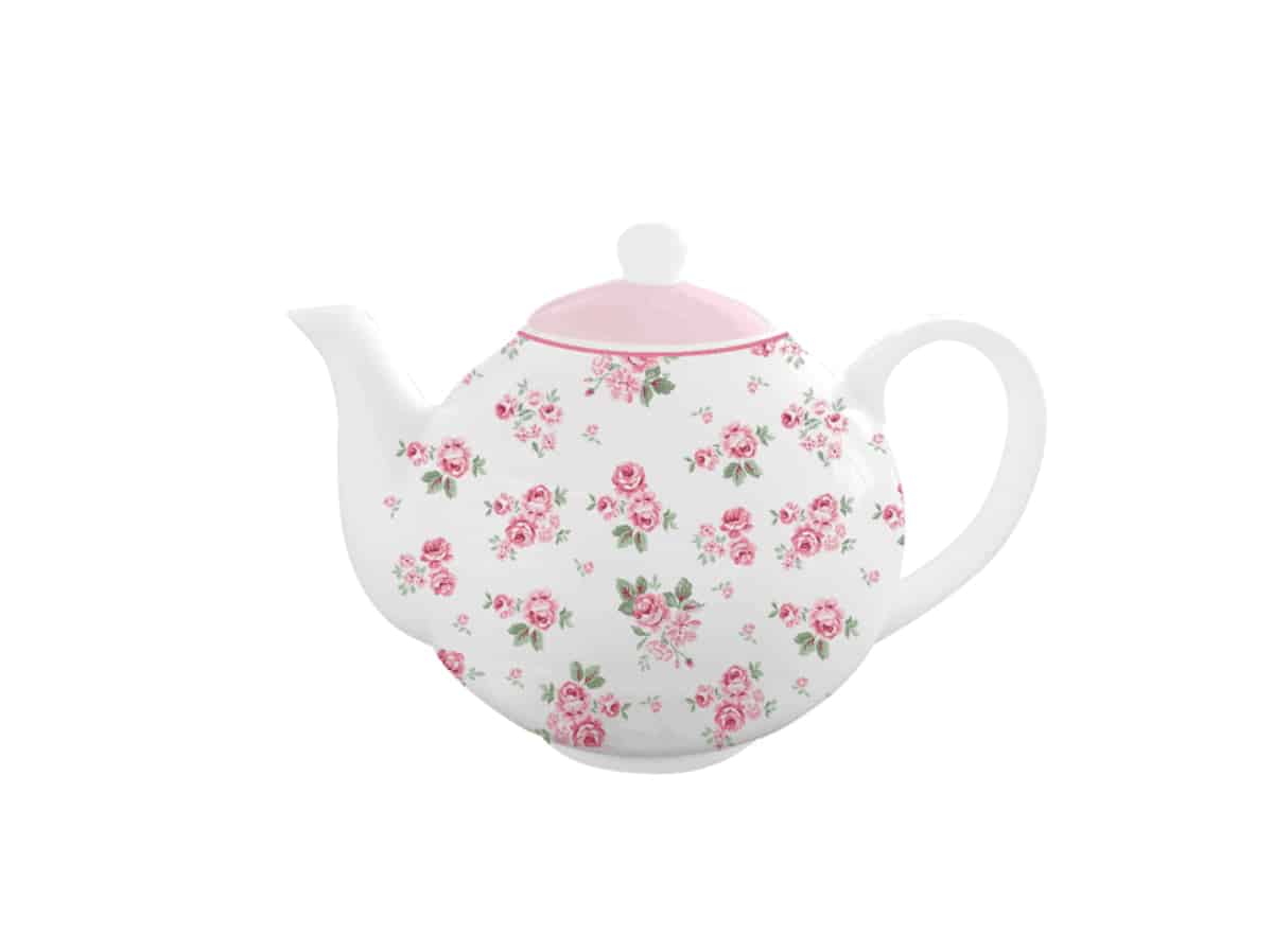 Чайник Белият чайник на Люси с розови рози върху него.
